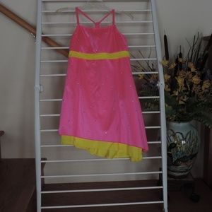 Baton twirling , dance or skating costume
